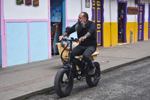 Electric bike climbing steep hill with senior rider demonstrating torque sensor performance