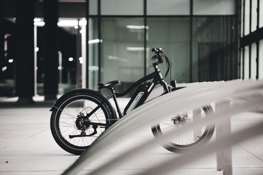 Rider adjusting suspension seat post on fat tire ebike for back pain relief