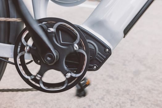 Commuter charging foldable ebike battery indoors in apartment