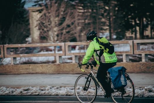 Electric bike rider navigating steep Addis Ababa street with traffic